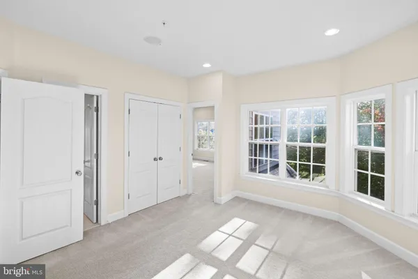 a bathroom with a bathtub and a window