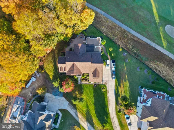 an aerial view of a house with garden space and street view