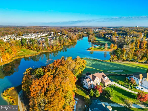 a view of a patio with table and chairs and potted plants