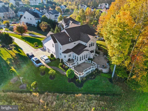 a view of a hallway with the wooden floor and staircase