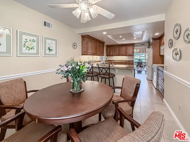 a view of a refrigerator in kitchen and wooden floor