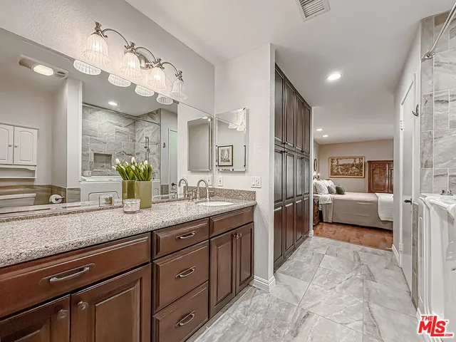 a utility room with sink dryer and washer