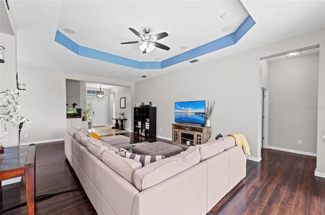 a view of a dining room with furniture and wooden floor