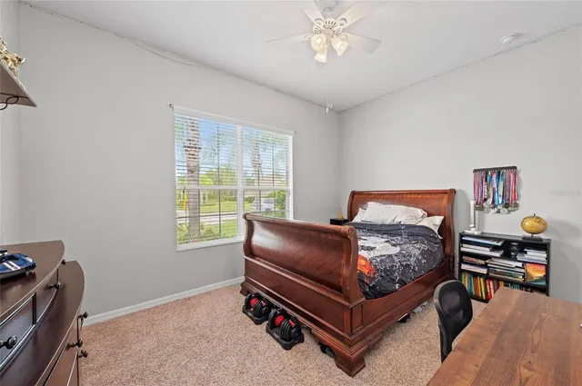 a view of a pathway with a wrought fence