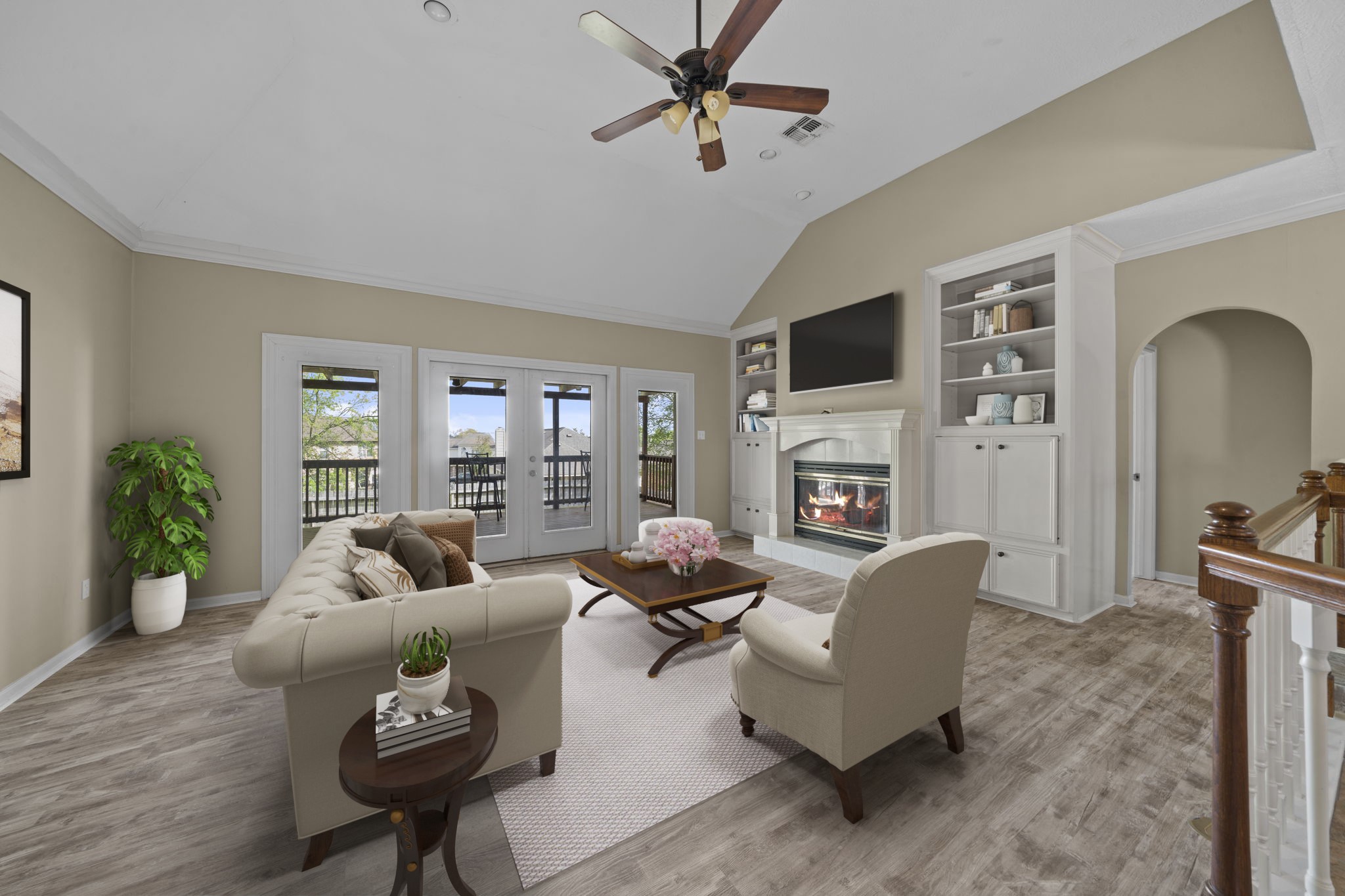 169 April Cove Montgomery, TX 77356 - Photo 22 of 39 Virtually Staged: This impressive living area showcases high ceilings, tile flooring, crown molding, and a cozy fireplace, perfect for relaxing during the cooler months.