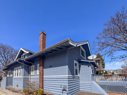 a front view of a house with fountain