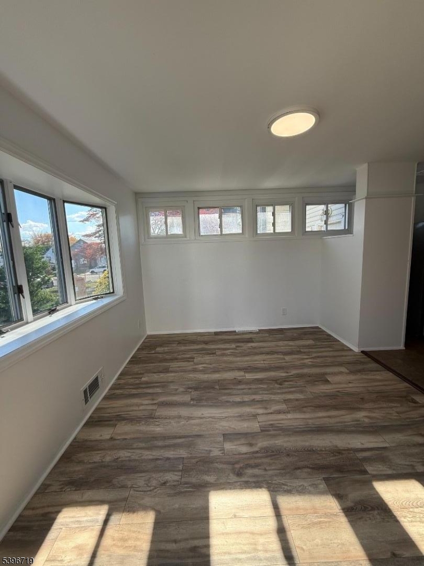 201 4th Street Clifton, NJ 07011 - Photo 2 of 8 a view of empty room with window