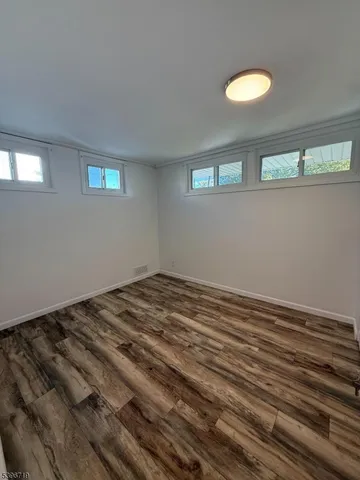 a view of a livingroom with wooden floor