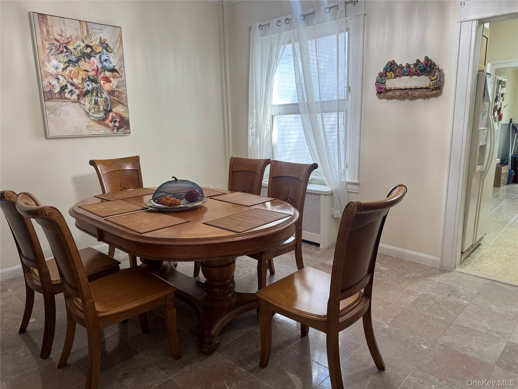 80-58 88th Road Queens, NY 11421 - Photo 6 of 21 a view of a dining room with furniture and window
