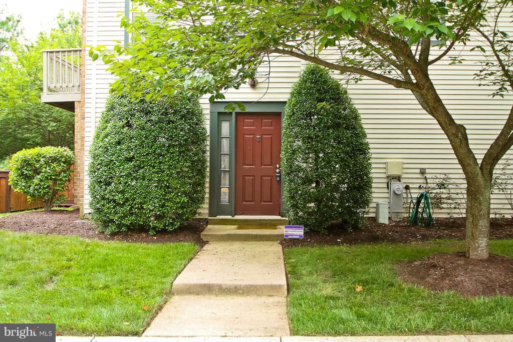 4739 Ridgeline Terrace, Unit 301 Bowie, MD 20720 - Photo 2 of 25 a front view of a house with a yard