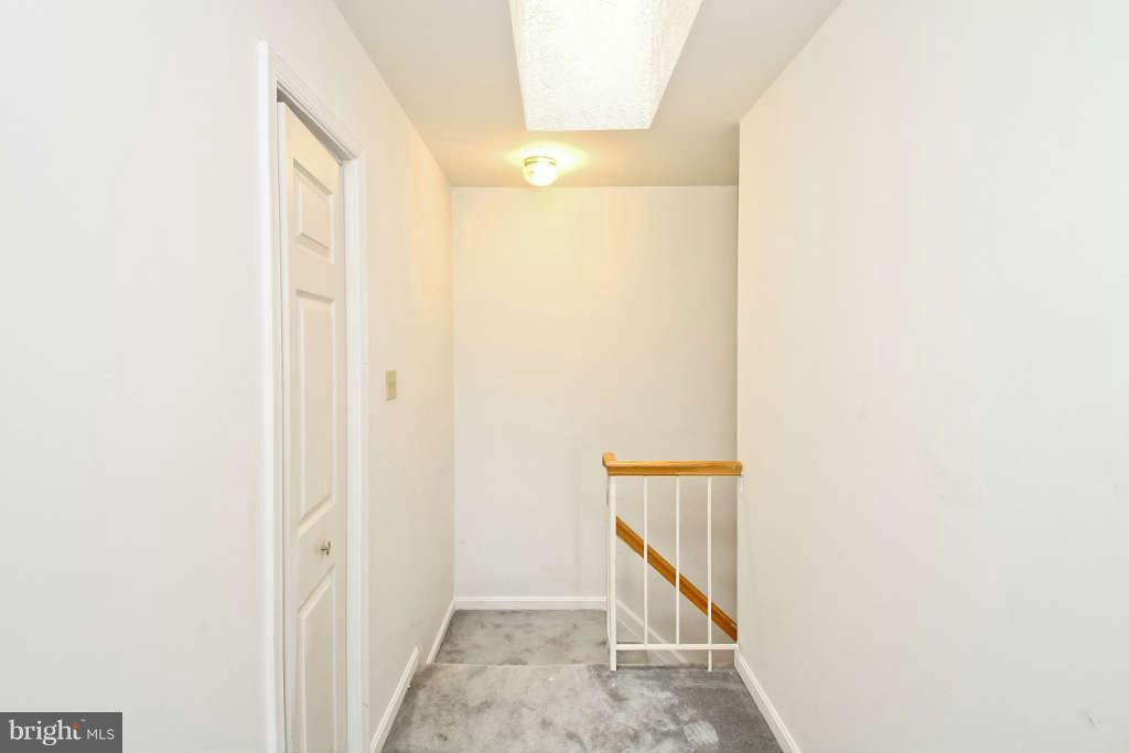4739 Ridgeline Terrace, Unit 301 Bowie, MD 20720 - Photo 11 of 25 a view of a hallway with staircase