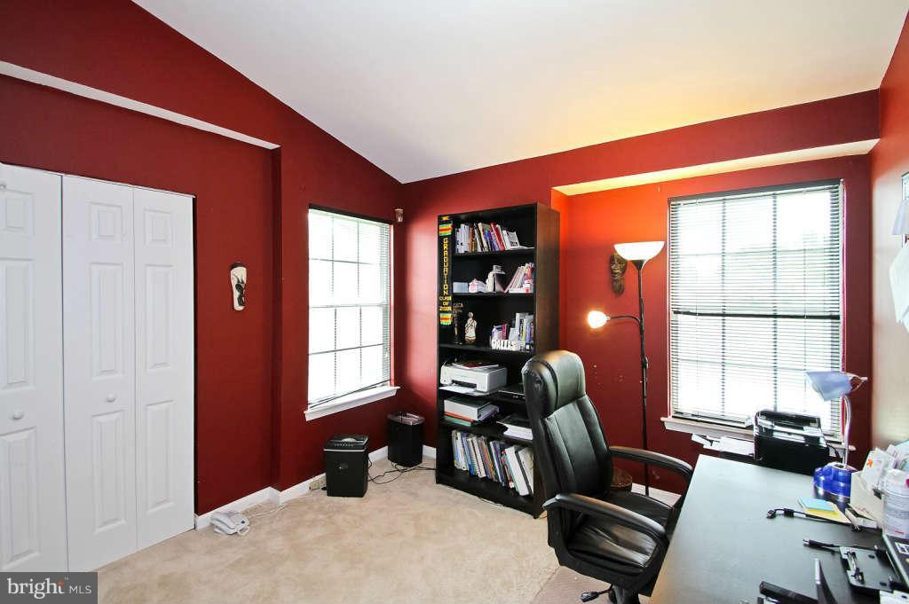4739 Ridgeline Terrace, Unit 301 Bowie, MD 20720 - Photo 15 of 25 a bedroom with furniture and a window