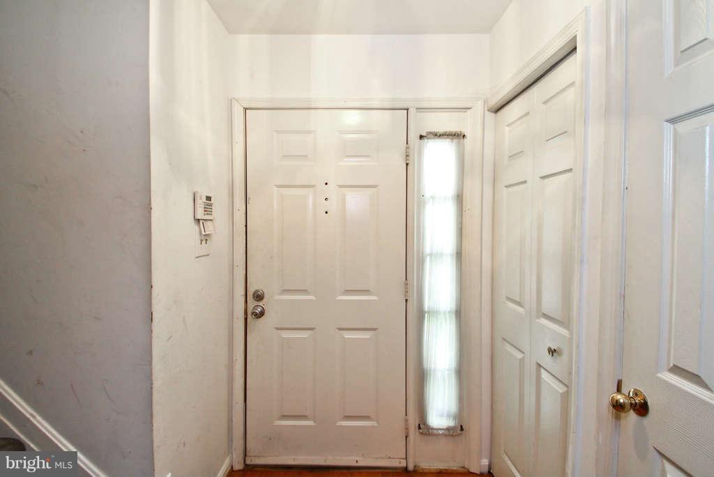 4739 Ridgeline Terrace, Unit 301 Bowie, MD 20720 - Photo 22 of 25 a bathroom with a glass shower door