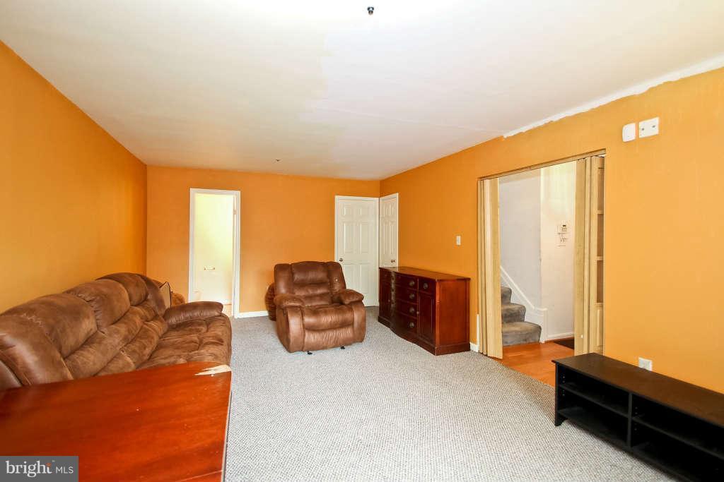 4739 Ridgeline Terrace, Unit 301 Bowie, MD 20720 - Photo 24 of 25 a bedroom with furniture and large windows
