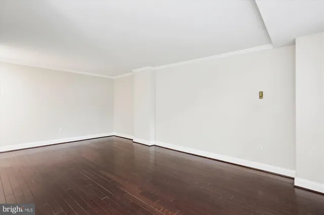 an empty room with wooden floor