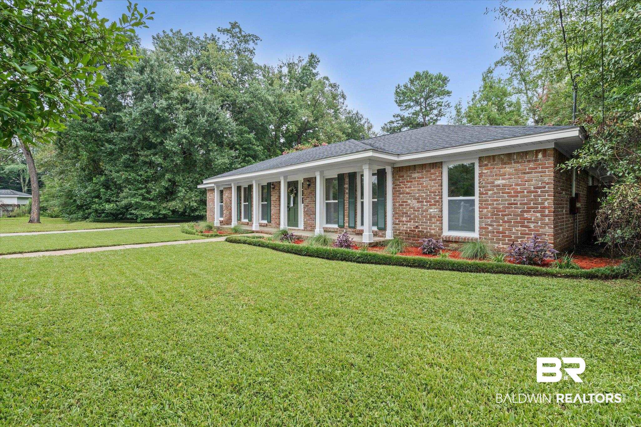 3655 Claridge Road South Mobile, AL 36608 - Photo 31 of 32 Ranch-style home with a porch, brick siding, a front yard, and a shingled roof