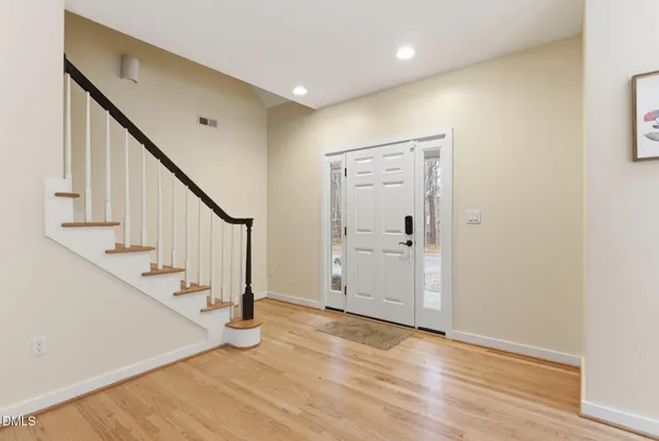 a kitchen with stainless steel appliances granite countertop a stove and a refrigerator