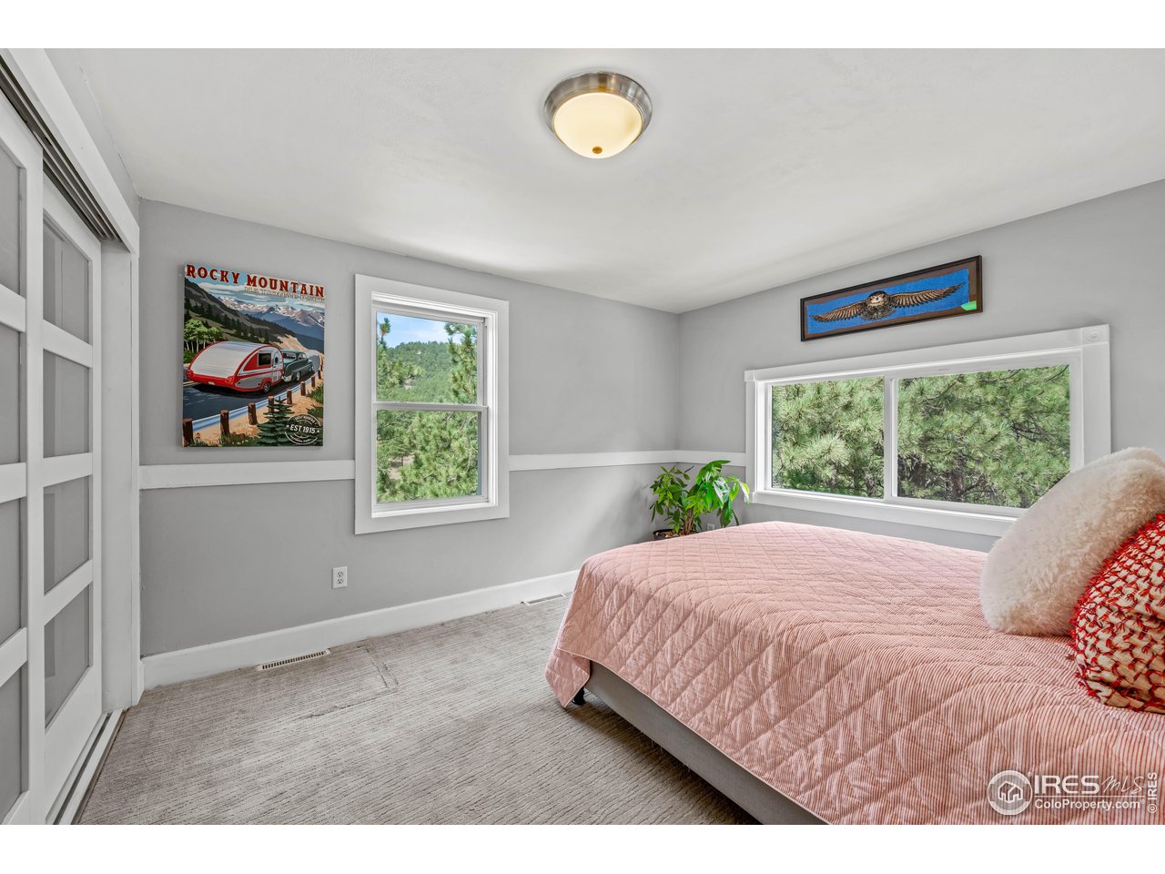 301 Valley Lane Boulder, CO 80302 - Photo 17 of 46 a bed sitting in a bedroom next to a window