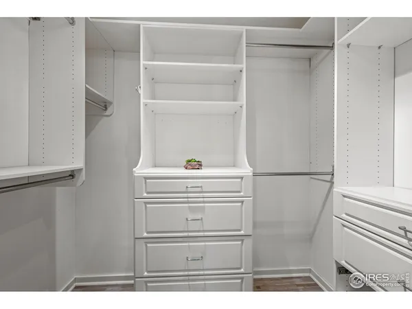 a backyard of a house with barbeque oven table and chairs