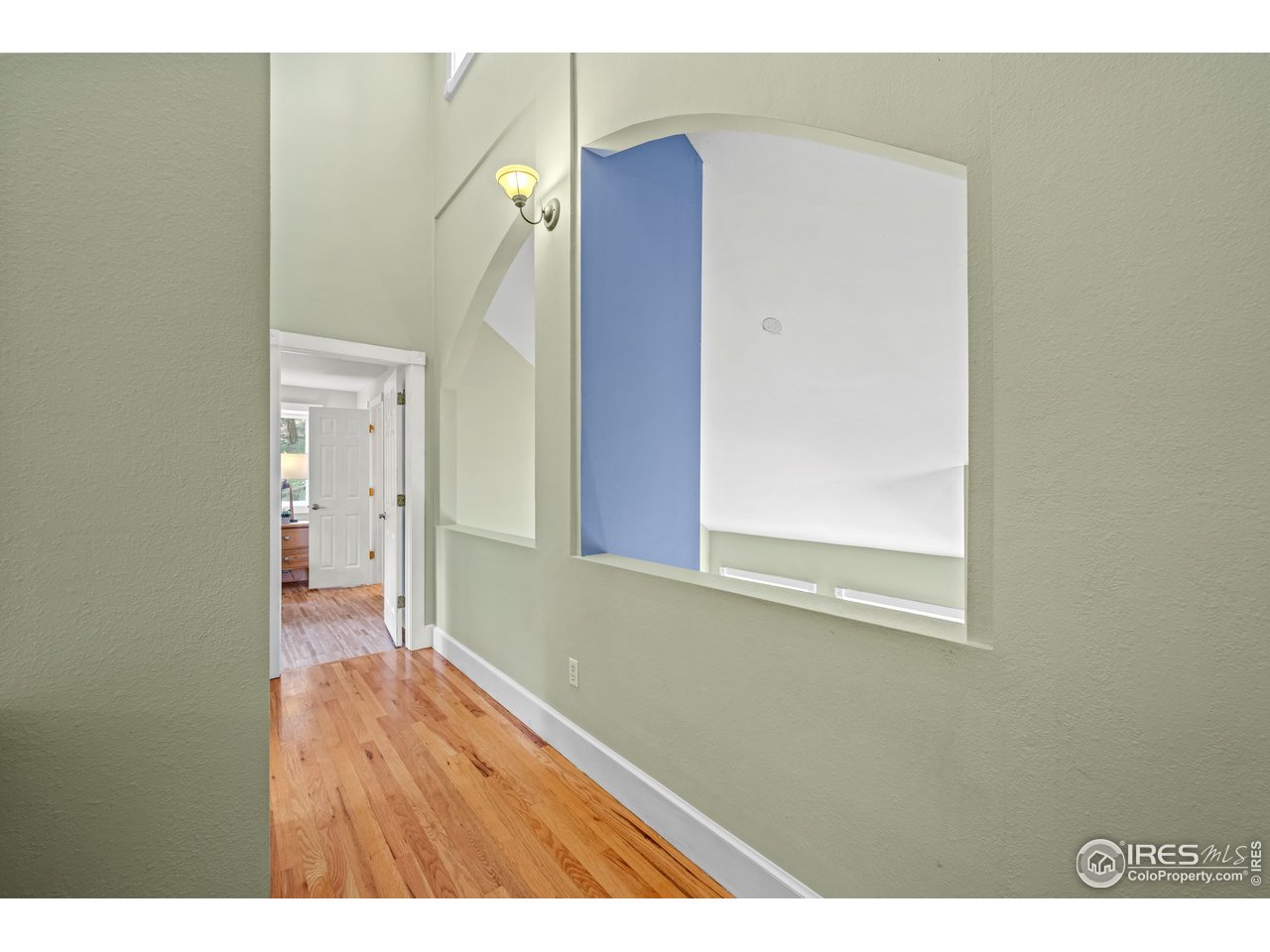 301 Valley Lane Boulder, CO 80302 - Photo 20 of 46 a view of an empty room with wooden floor