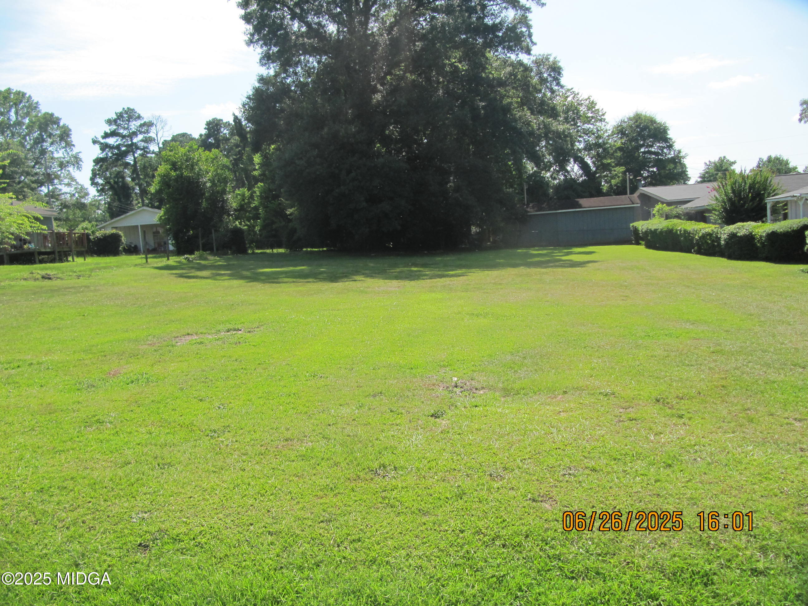 131 Sun Valley Drive Macon, GA 31211 - Photo 3 of 3 a view of yard with swimming pool and green space