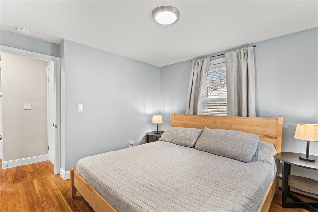 13 Cherry Hill Drive Seekonk, MA 02771 - Photo 13 of 40 a bedroom with a bed and a lamp