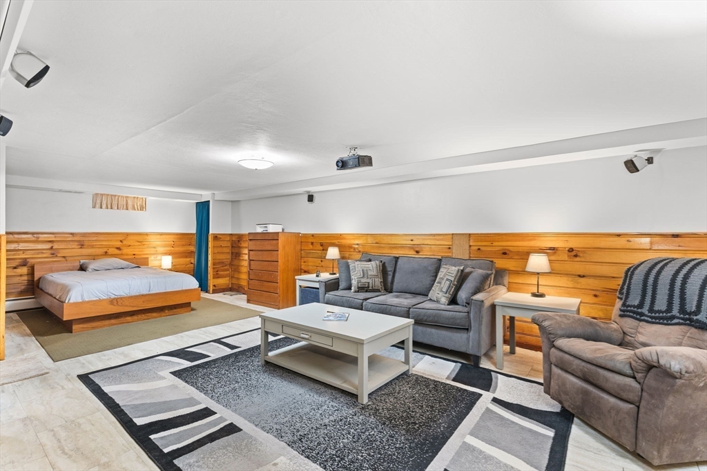 13 Cherry Hill Drive Seekonk, MA 02771 - Photo 26 of 40 a living room with furniture and a rug