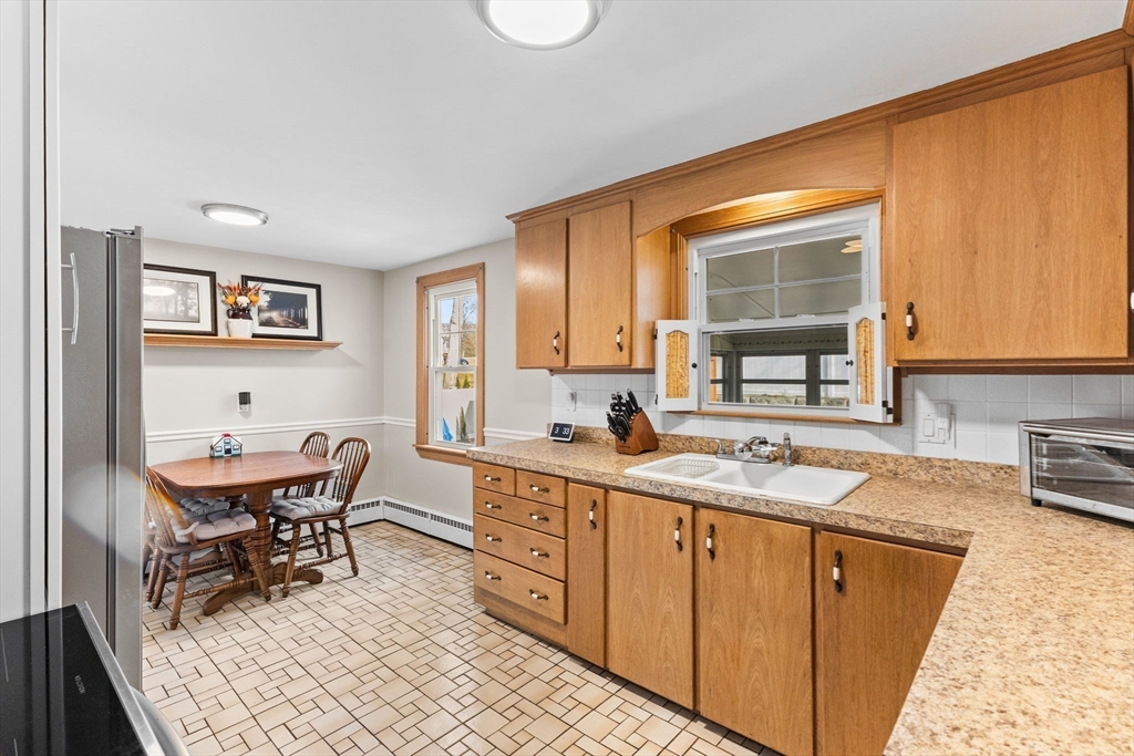 13 Cherry Hill Drive Seekonk, MA 02771 - Photo 10 of 40 a view of a kitchen counter space and dining room