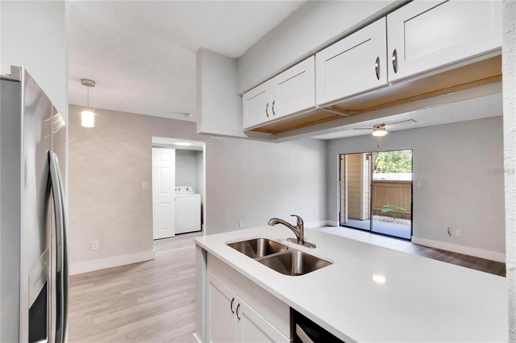8718 Mallard Reserve Drive, Unit 101 Tampa, FL 33614 - Photo 12 of 25 a kitchen with a sink and cabinets