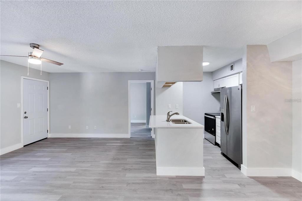 8718 Mallard Reserve Drive, Unit 101 Tampa, FL 33614 - Photo 17 of 25 a view of a kitchen with a sink and refrigerator