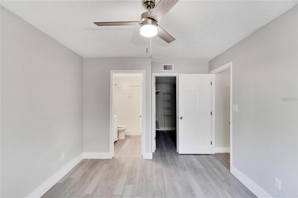 8718 Mallard Reserve Drive, Unit 101 Tampa, FL 33614 - Photo 18 of 25 a view of empty room with wooden floor
