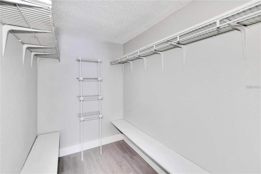 8718 Mallard Reserve Drive, Unit 101 Tampa, FL 33614 - Photo 19 of 25 a view of walk in closet with empty racks