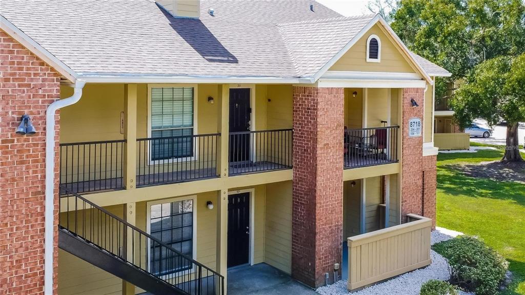 8718 Mallard Reserve Drive, Unit 101 Tampa, FL 33614 - Photo 25 of 25 a view of a house with backyard and porch
