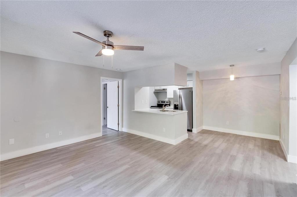 8718 Mallard Reserve Drive, Unit 101 Tampa, FL 33614 - Photo 5 of 25 a view of kitchen with wooden floor