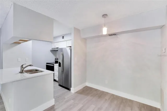 a kitchen with a refrigerator a sink and dishwasher