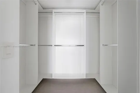 a view of an empty room with windows