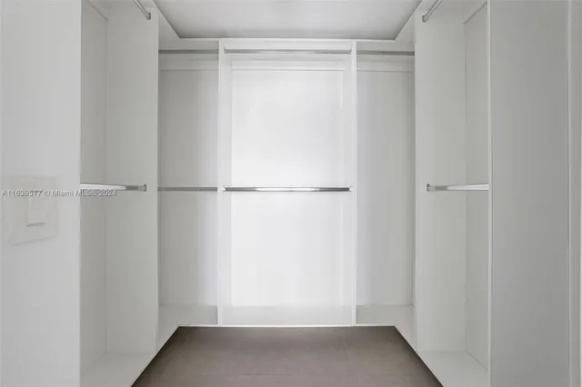 a view of an empty room with windows