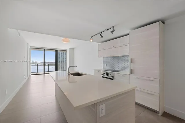 a kitchen with a stove and a refrigerator