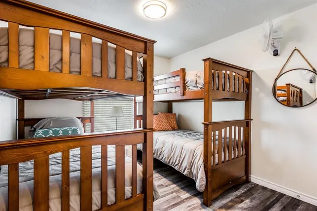 a bedroom with furniture and a window