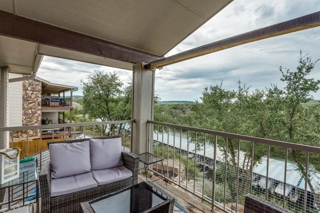 a view of roof deck with furniture