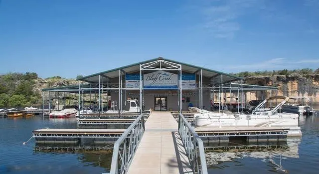 a view of a balcony with chairs and wooden floor