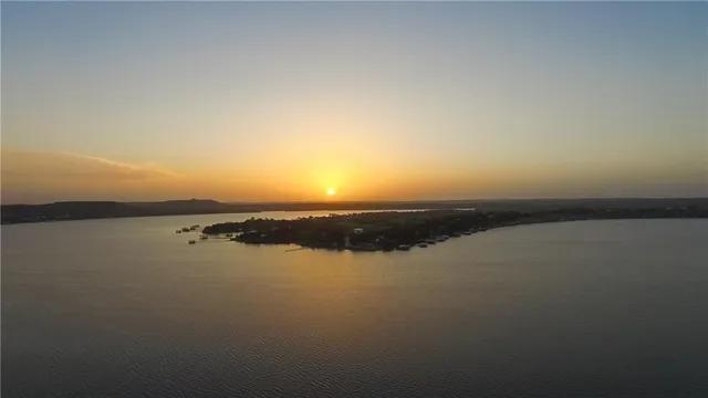 a view of lake with mountain in the background