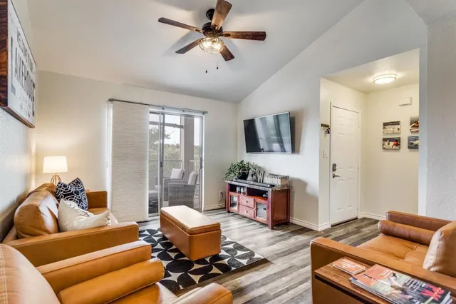a living room with furniture or couch and a flat screen tv
