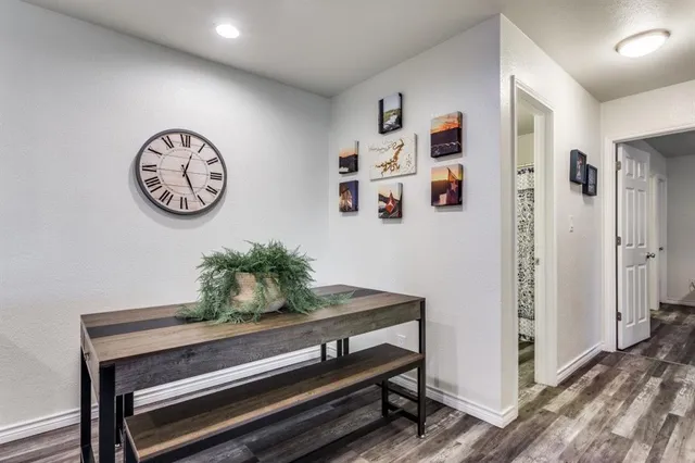 a hallway with with wooden furniture
