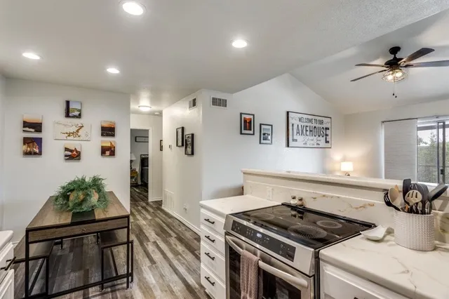 a stove top oven sitting inside of a kitchen