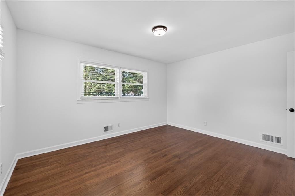 3061 Glendale Court Decatur, GA 30032 - Photo 14 of 21 an empty room with wooden floor and windows
