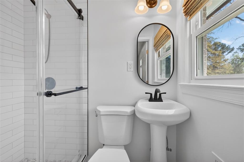 3061 Glendale Court Decatur, GA 30032 - Photo 15 of 21 a bathroom with a toilet sink and mirror