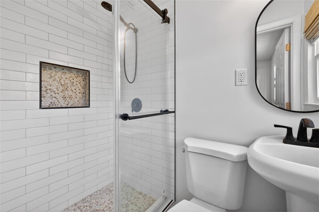 3061 Glendale Court Decatur, GA 30032 - Photo 16 of 21 a bathroom with a toilet sink and mirror