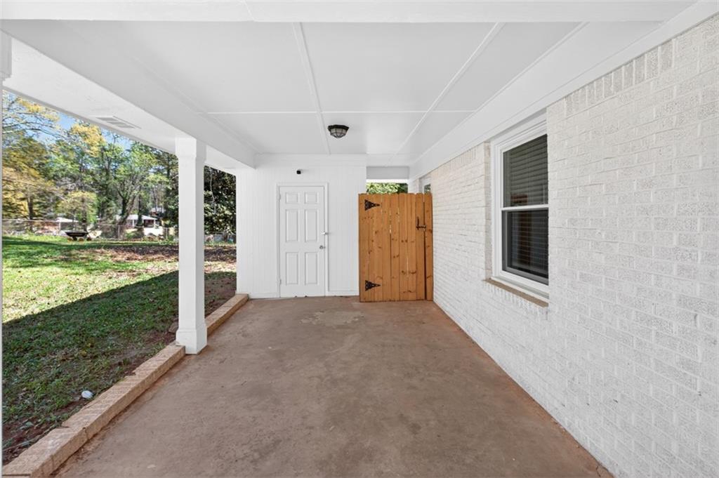 3061 Glendale Court Decatur, GA 30032 - Photo 6 of 21 a view of a porch with wooden floor and backyard