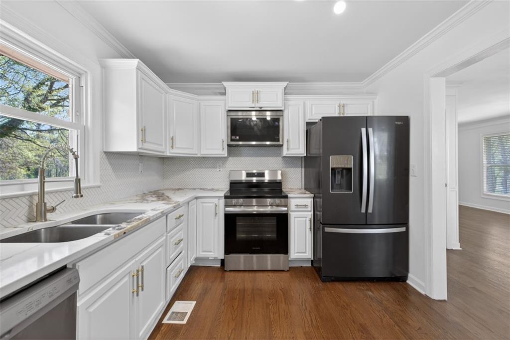 3061 Glendale Court Decatur, GA 30032 - Photo 7 of 21 a kitchen with a sink stove and refrigerator
